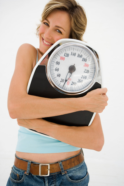 A woman hugging scale