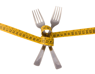 A measuring tape and forks
