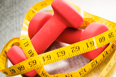 Dumbbells and measuring tape