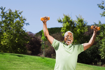 A happy, healthy senior man carrying dumb bells A happy, healthy senior man carrying dumb bells