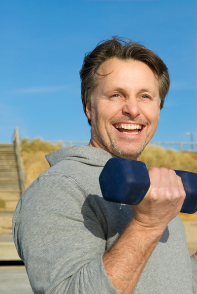 Happy looking guy with hand weight