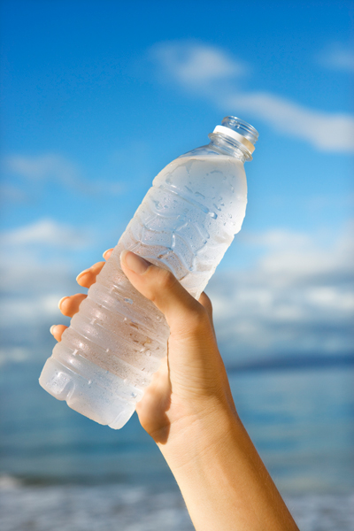 Hand holding a bottled water Hand holding a bottled water