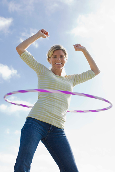 Woman doing hula hoops Woman doing hula hoops